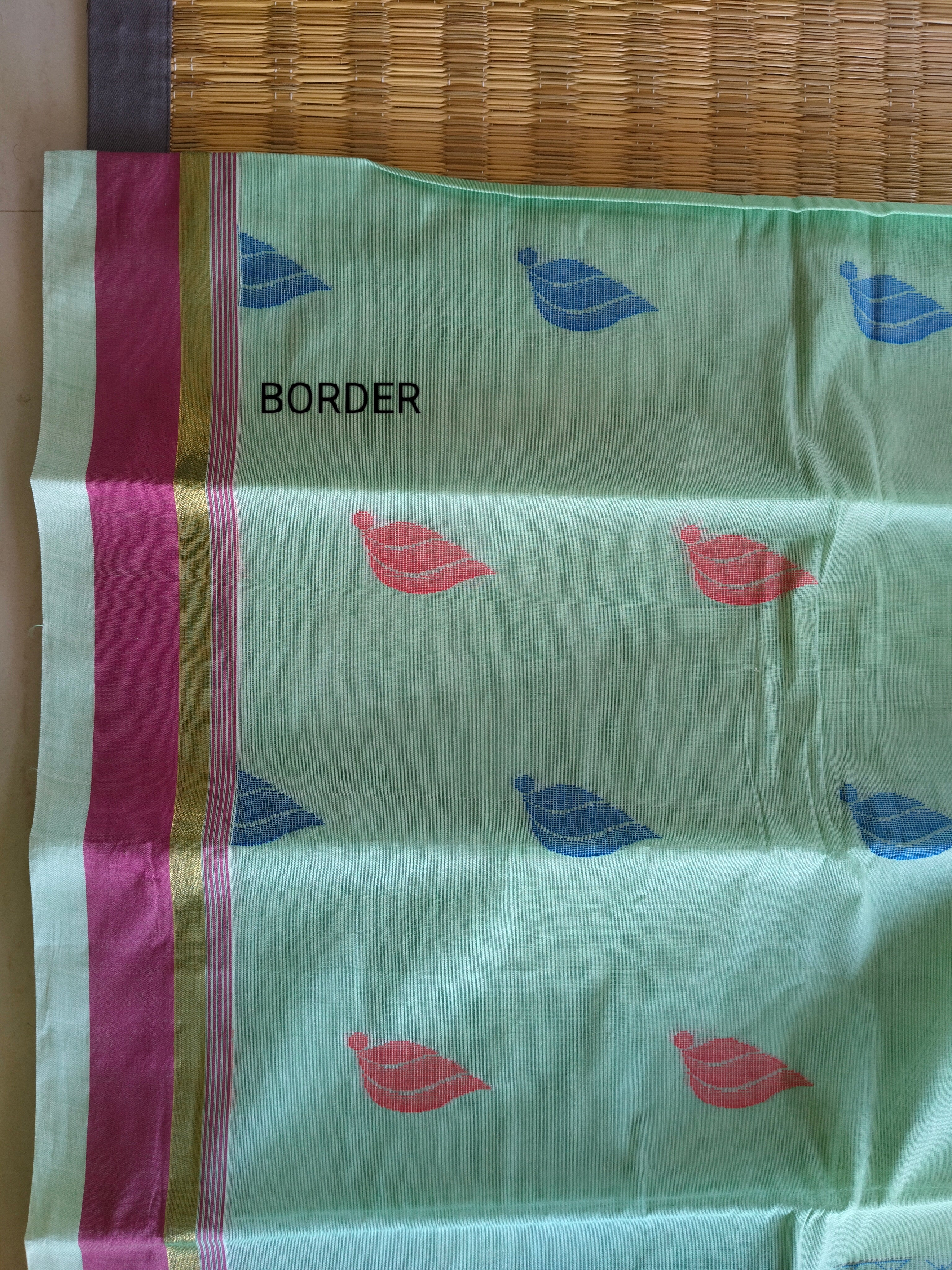 Tea green cotton saree with flower buttas