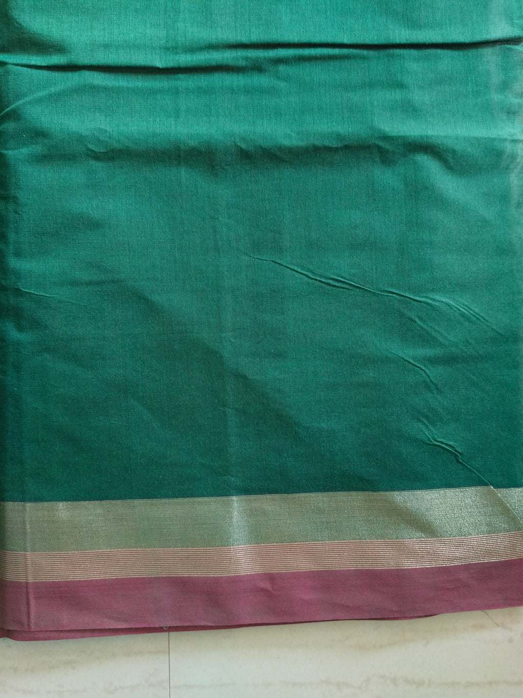 Cotton saree with golden zari & orange buttas.